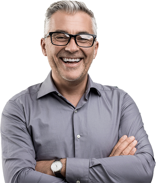 Smiling man with glasses and crossed arms, representing a team of expert consultants ready to assist with making your dreams of studying or living abroad come true.