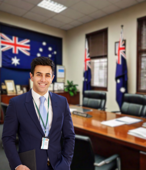 Smiling consultant in an office with Australian flags, representing expert Australian immigration consultants in Ahmedabad who assist clients in achieving their dreams of studying abroad, exploring new cultures, and expanding their horizons.