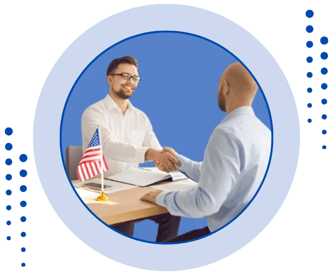 Client and consultant shaking hands across a desk with US flag, symbolizing trusted partnership with top US visa consultants in Ahmedabad for immigration, work visas, green cards, and permanent residency support