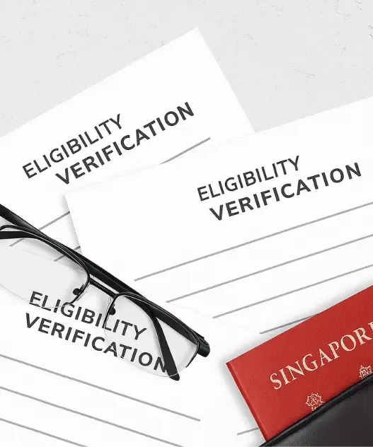 Eligibility verification documents with glasses and Singapore passport, representing visa qualification checks by authorized Singapore visa agents in India
