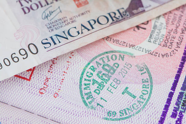 Singapore visa stamp and Singapore currency note representing visa categories available for Indian travelers