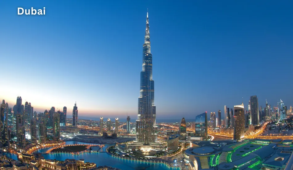 Night view of Dubai’s skyline with Burj Khalifa illuminated against a twilight sky, highlighting Dubai as one of the best countries to migrate for high-paying, tax-free jobs, luxury lifestyle, and global business opportunities.