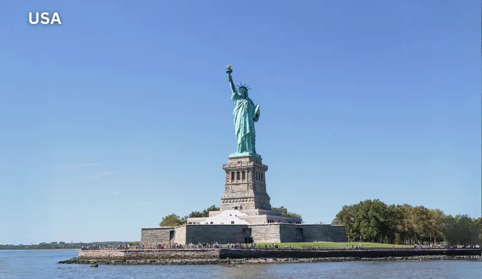 Daytime view of the Clear view of the Statue of Liberty on Liberty Island in New York, symbolizing the United States as one of the best countries to migrate for high salaries, global career opportunities, world-class education, and diverse lifestyles.